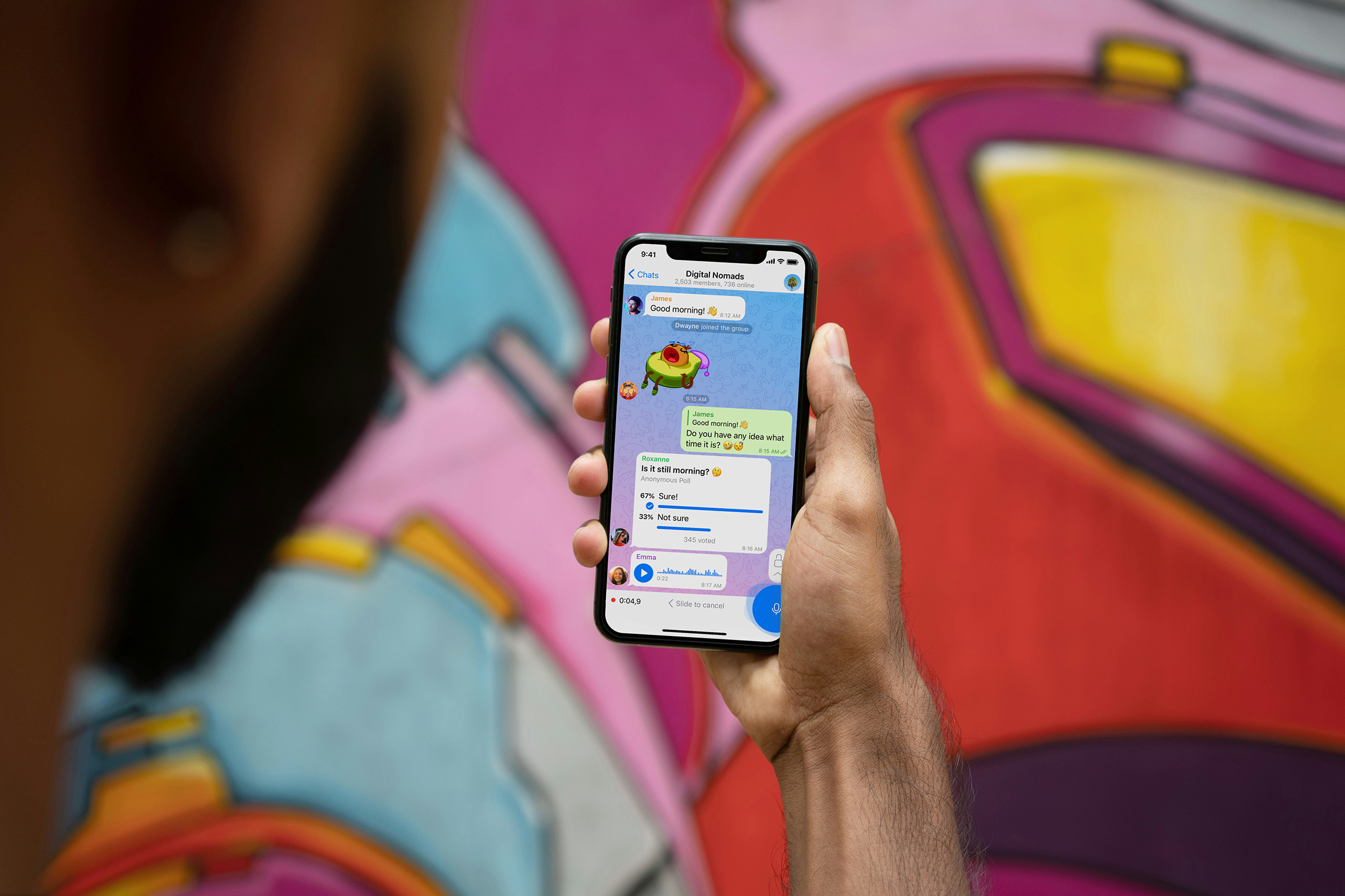 A man lookig at his Telegram chat conversation